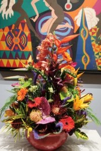 “La Baker” (1977), Loïs Mailou Jones, with floral arrangement by the Osterville Garden Club.