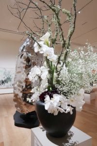“Artificial Rock #85” (2005), Zhan Wang, with floral arrangement by the Community Garden Club of Duxbury.