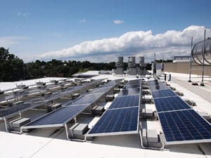 A rooftop solar array. Banner Photo