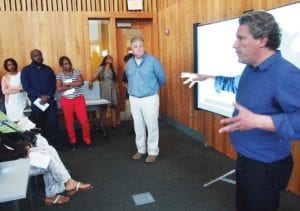 Architect Derek Rubinoff addresses abutters during a meeting on the development of 124-126 Warren Street. Banner Photo