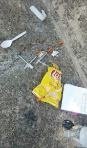 Drug paraphernalia, hospital bracelets and garbage litter Clifford Playground and the surrounding area. Photo Credit: Leon Rivera