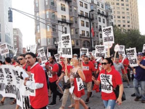 demonstrators march on Huntington Avenue. Banner Photo