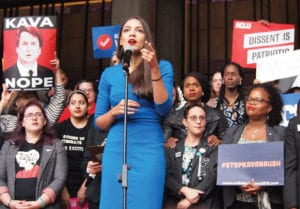 Alexandria Ocasio-Cortez, who won the Democratic primary for New York’s 14th Congressional District, addresses demonstrators at City Hall Plaza gathered in opposition to the Trump administration’s Supreme Court nominee Brett Kavanaugh. Banner Photo