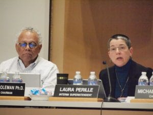 Interim BPS Superintendent Laura Perille makes the case for closing the West Roxbury Education Complex as School Committee member Hadein Coleman looks on. BANNER PHOTO