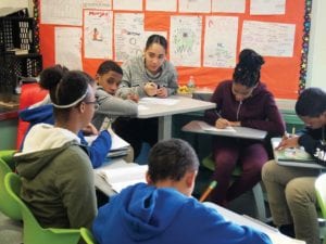 Students in an eighth-grade English Language Arts class in a group discussion at the Joseph Lee school in Dorchester. BANNER PHOTO