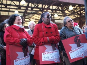 Teachers, nurses and other school staff rallied in Dudley Square outside the BPS central office. BANNER PHOTO