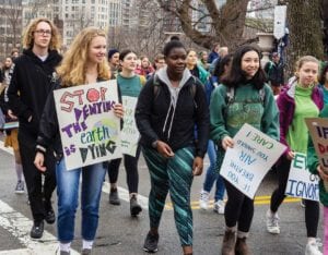 Students march in front of the State House as part of national Youth Climate Strike. PHOTO: TREA LAVERY