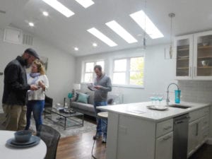Prospective buyers view a two-bedroom, $489,999 unit at 4 Wyoming Street in Roxbury. BANNER PHOTO