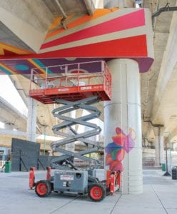 Silvia Lopez Chavez’s in-progress mural featuring her signature bold shapes and arrows. PHOTO: CELINA COLBY