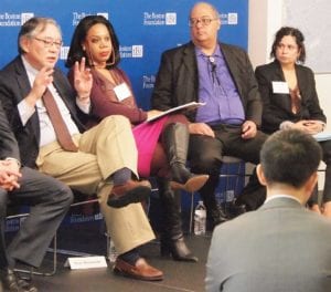 Institute for Asian American Studies Paul Watanabe gives a presentation at The Boston Foundation in May as Trotter Institute researcher Rita Kiki Edozie, Institute for New England Native American Studies Director J. Cedric Woods and Gaston Institute Director Lorna Rivera look on. BANNER FILE PHOTO