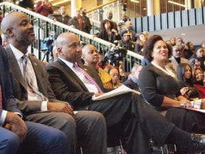 Otis Rolley of the Rockefeller Foundation, state Rep. Russell Holmes, MassVOTE Director Cheryl Craford and NAACP Boston Branch President Tanisha Sullivan during last week’s press conference. BANNER PHOTO