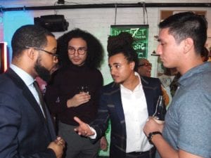 Armani White (second from right) chats with Segun Idowu, Alex Ponte-Capellan and Brandon Russell during a fundraiser at District 7 in Roxbury. BANNER PHOTO