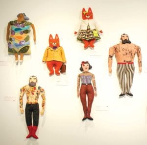 Mimi Kirchner’s handmade dolls welcome visitors to the “Child’s Play” exhibition. PHOTO: CELINA COLBY