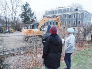 City Councilor Andrea Campbell views the construction site of a proposed 13-unit condominium building at 54 River Street, with 52R River Street to the right. BANNER PHOTO