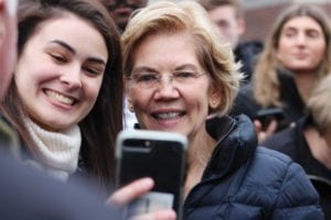 Massachusetts Sen. Elizabeth Warren takes selfies with supporters outside of the Webster Elementary School in Manchester, New Hampshire. PHOTO: ALEXA GAGOSZ