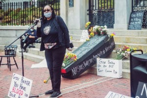 Priscilla Flint-Banks addresses a gathering in protest of the state reopening plan. Photo: Lauren Miller
