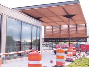 An outdoor pavilion under construction at the Roxbury branch library. BANNER PHOTO