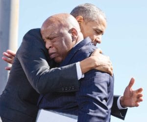 The late John Lewis embraces then-President Barack Obama during a 50th anniversary of a civil rights march on the Edmund Pettus Bridge in Alabama. OFFICIAL WHITE HOUSE PHOTO BY PETE SOUZA