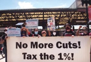 Demonstrators gather at the Nubian Square bus terminal to demonstrate in favor of increased corporate taxes. PHOTO: MORGAN C. MULLINGS