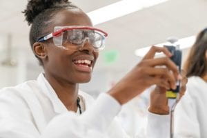 PHOTO: COURTESY OF BIOGEN COMMUNITY LAB A student finds joy in scientific discovery during a 2019 Community Lab summer program. PHOTO: COURTESY OF BIOGEN COMMUNITY LAB