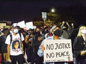 Demonstrators marched from Nubian Square to City Hall Friday evening to protest the police shooting of Breonna Taylor, who was shot while sleeping in bed. BANNER PHOTO