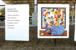 Larry Pierce’s poem “Stream of Consciousness” is displayed alongside prints of his artwork at the Chain Link Gallery by Roxbury Community College. PHOTO: CELINA COLBY