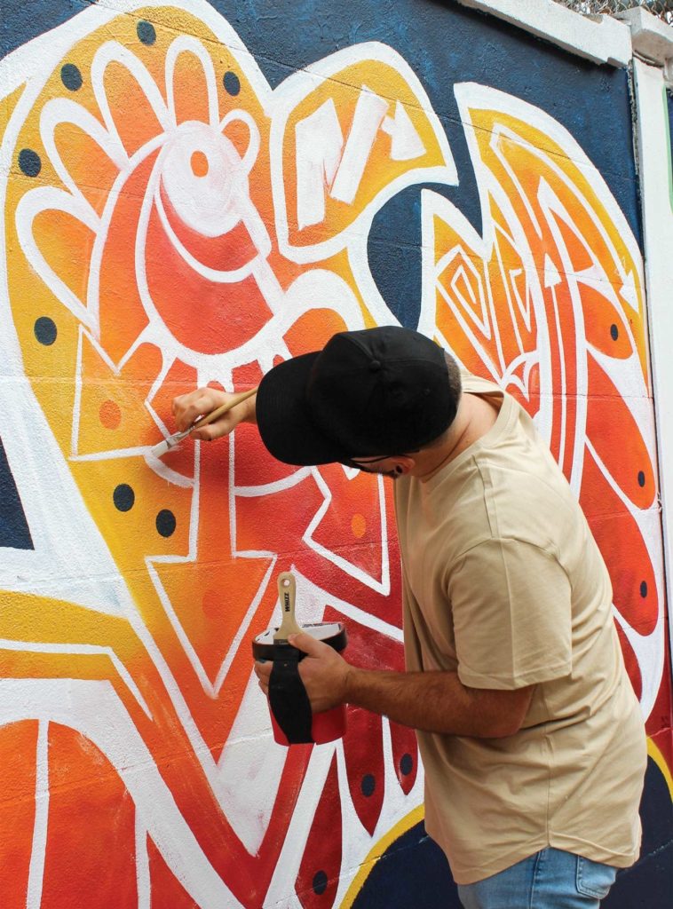 El Punto mural artists paint the color of freedom El Punto mural artists paint the color of freedom