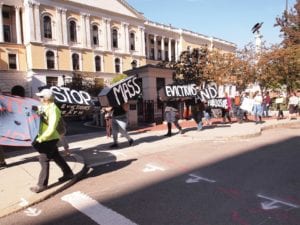 Demonstrators with City Life/Vida Urbana march to the front steps of the State House PHOTO: MORGAN C. MULLINGS