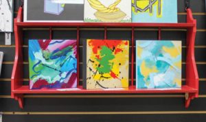 Three paintings by Ivan Richiez (Instagram: @eyevan617) on sale at the DAP store. PHOTO: CELINA COLBY