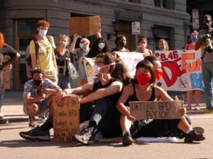Protestors block the intersection of Court and Congress streets, Peters Park demonstration. BANNER PHOTO