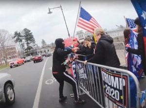 Video evidence contradicts a police account that Jean-Jacques clenched his hand into a fist, drew it back and struck a demonstrator. Here he appears to grab at her water bottle.