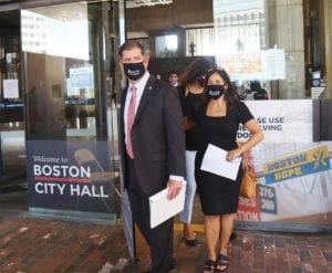 Walsh walks out of Boston City Hall with Boston Public Schools Superintendent Brenda Cassellius