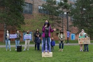 Boston City Councilor Michelle Wu, who is running for mayor, speaks during a rally Saturday to promote her Green New Deal for Boston Public Schools outside English High School.