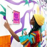Local artist Mithsuca Berry encourages ICA visitors to get creative